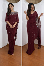 Woman wearing a maroon saree with silver embellishments in two different poses on a white background.